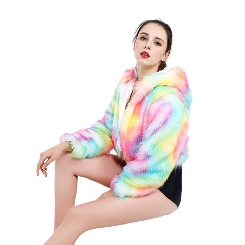 Person wearing a colorful led light up fur coat on a white background