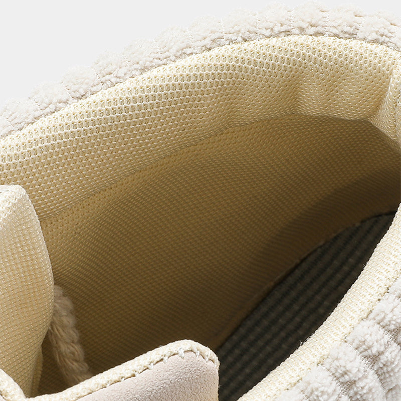 Close-up of a textured beige fabric surface