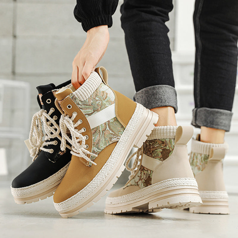 Three pairs of boots with camouflage pattern on a neutral background