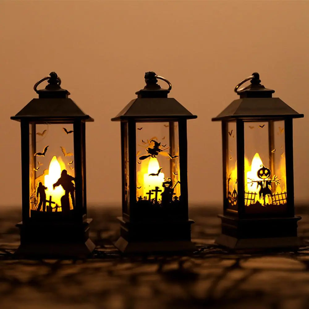 Three Halloween-themed lanterns with glowing interior scenes on a dark background.