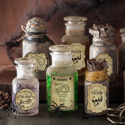 Collection of vintage-style poison bottles with labels on a dark surface.