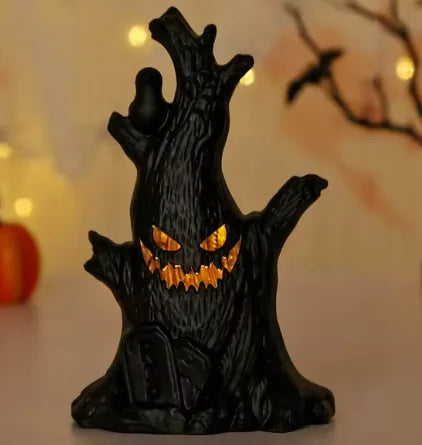 Black tree stump with glowing orange eyes on a blurred Halloween-themed background