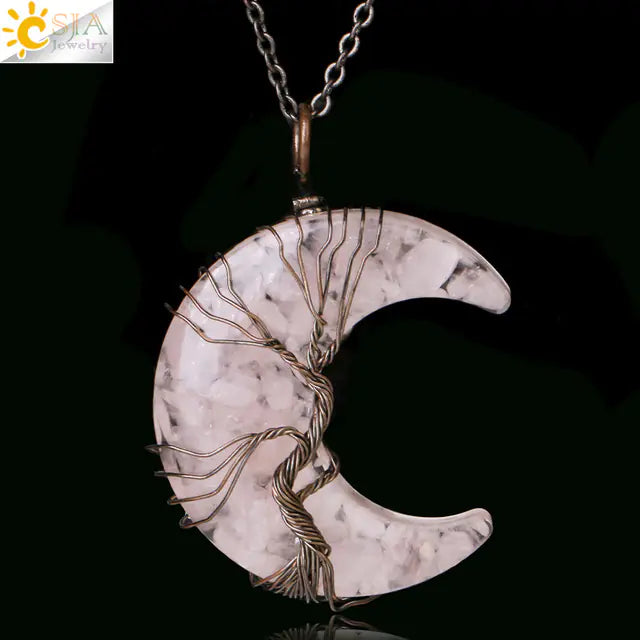 Crescent moon-shaped pendant with wire wrapping on a black background