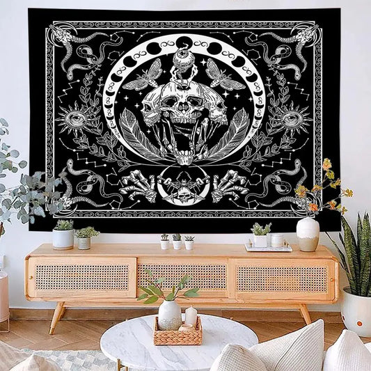 Decorative tapestry with a skull design hanging above a wooden console table in a living room.