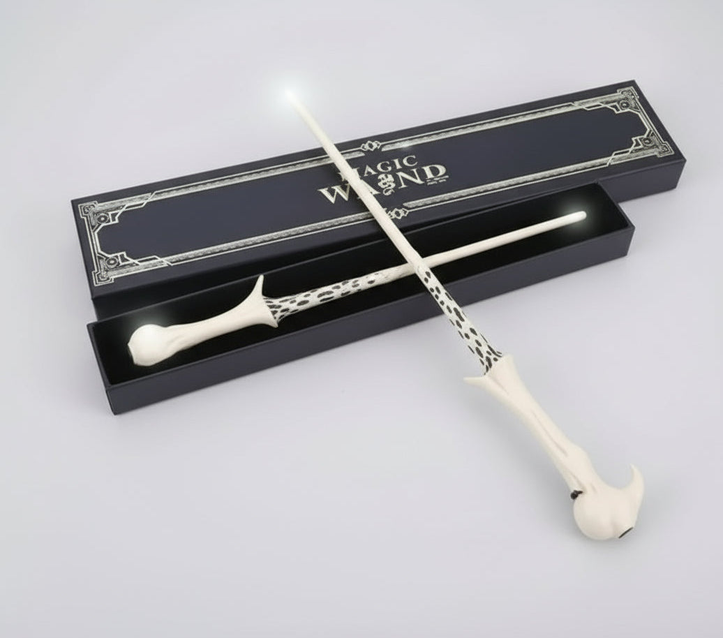 White magic wand with decorative handle and packaging on a white background