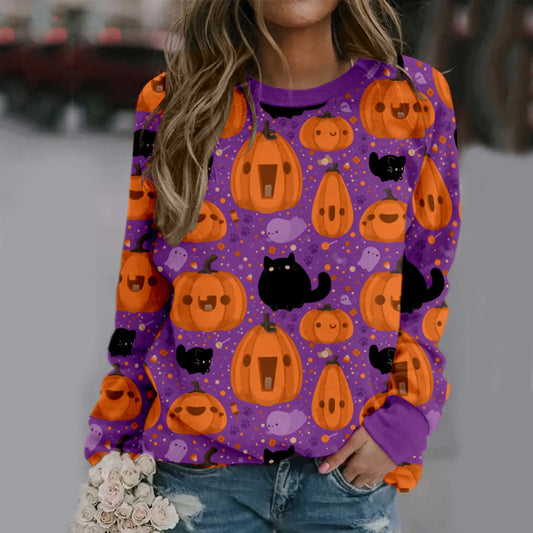 Person wearing a Halloween-themed purple sweatshirt with pumpkins and cats.