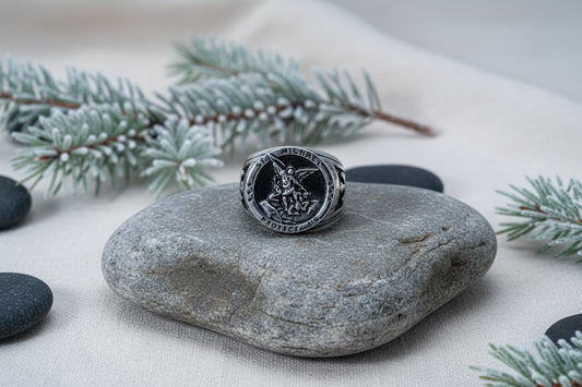 Silver ring with St. Michael the Archangel emblem on a white background