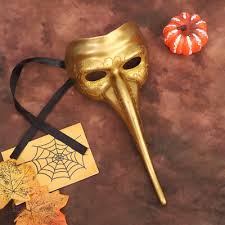 Gold mask with a brown background and decorative elements