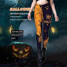 Halloween-themed leggings with pumpkins and text on a dark background