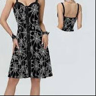 Black floral dress worn by a model on a white background