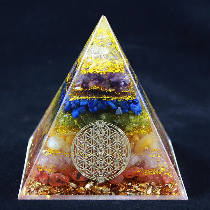 Triangular pyramid with crystals and a gold emblem on a dark background