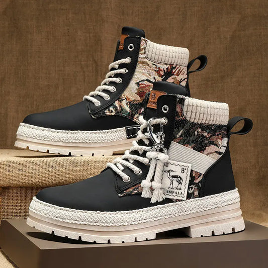 Black and white boots with patterned accents on a textured surface