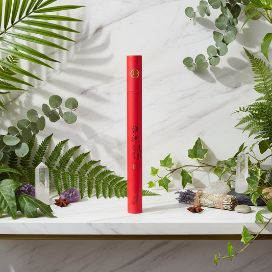 Red cylindrical incense sticks with black text on a white background