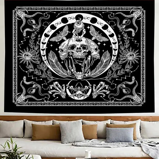 Decorative tapestry with skull and snake design on a wall above a sofa.