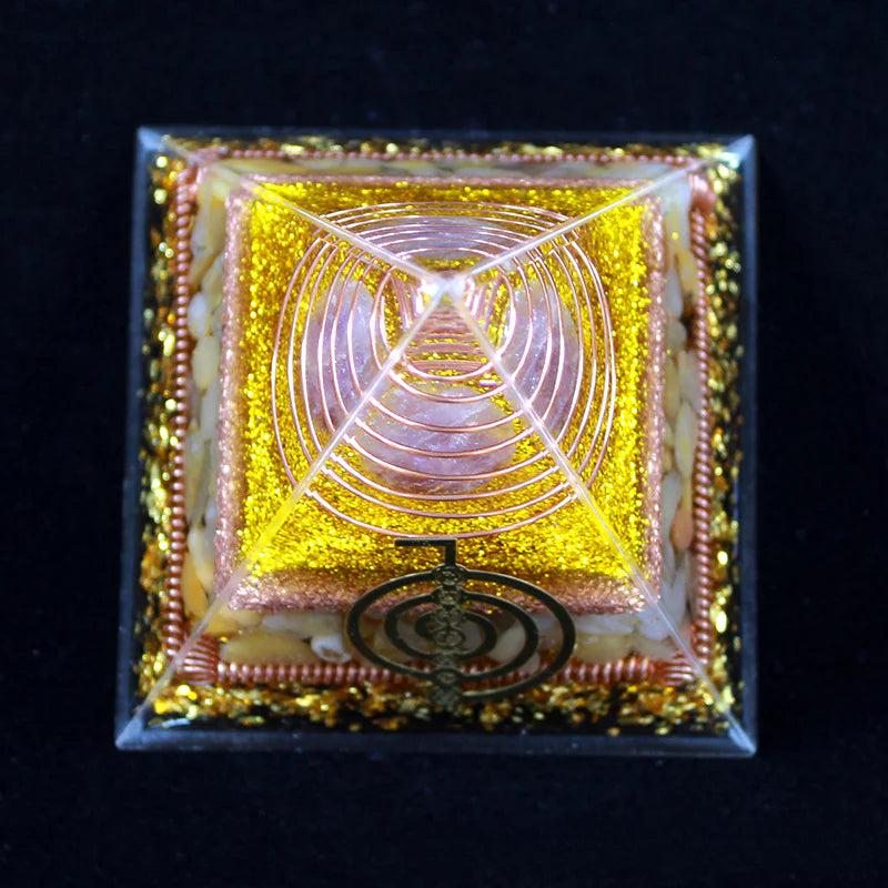 Decorative box with geometric design and gold accents on a black background