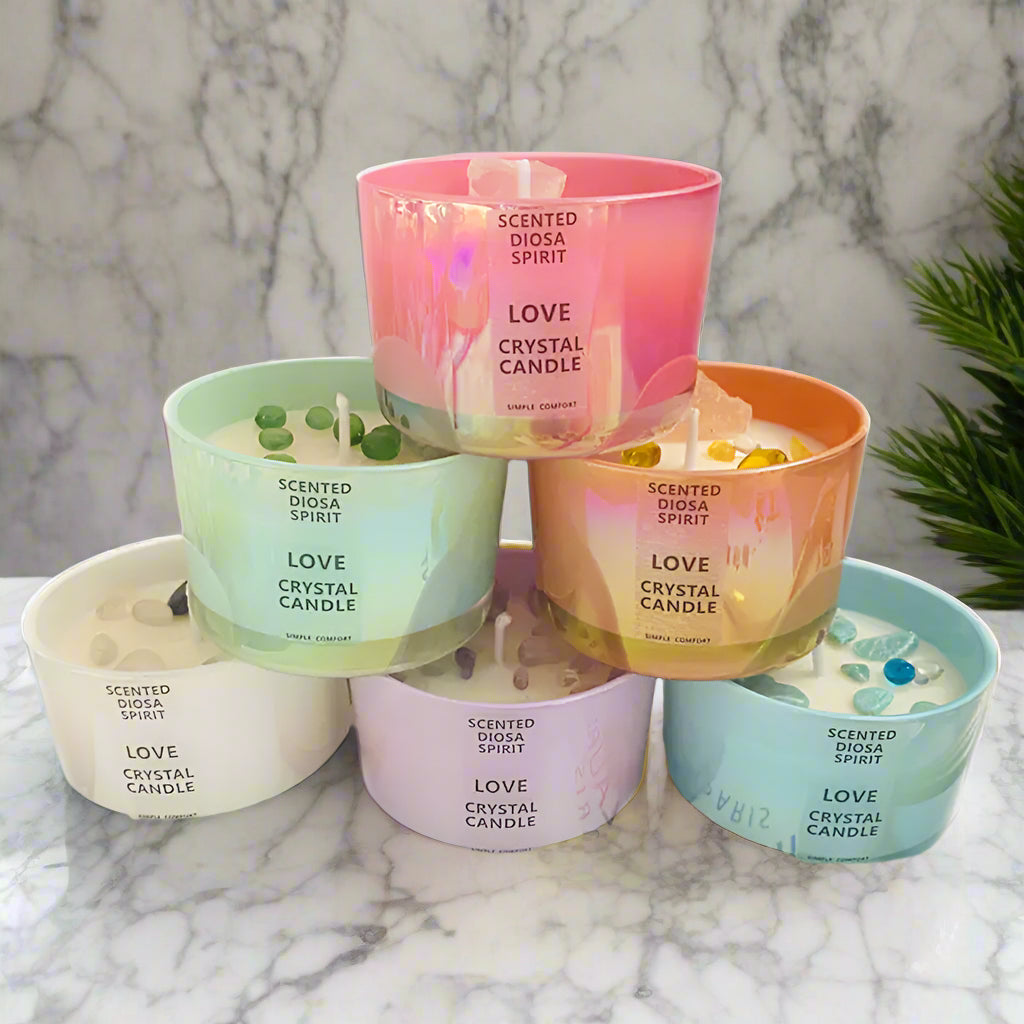 Set of scented crystal candles with colorful labels on a white background