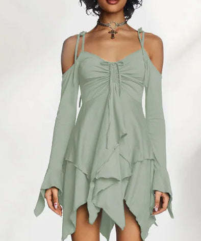 Green dress with ruched bodice and layered skirt on a white background