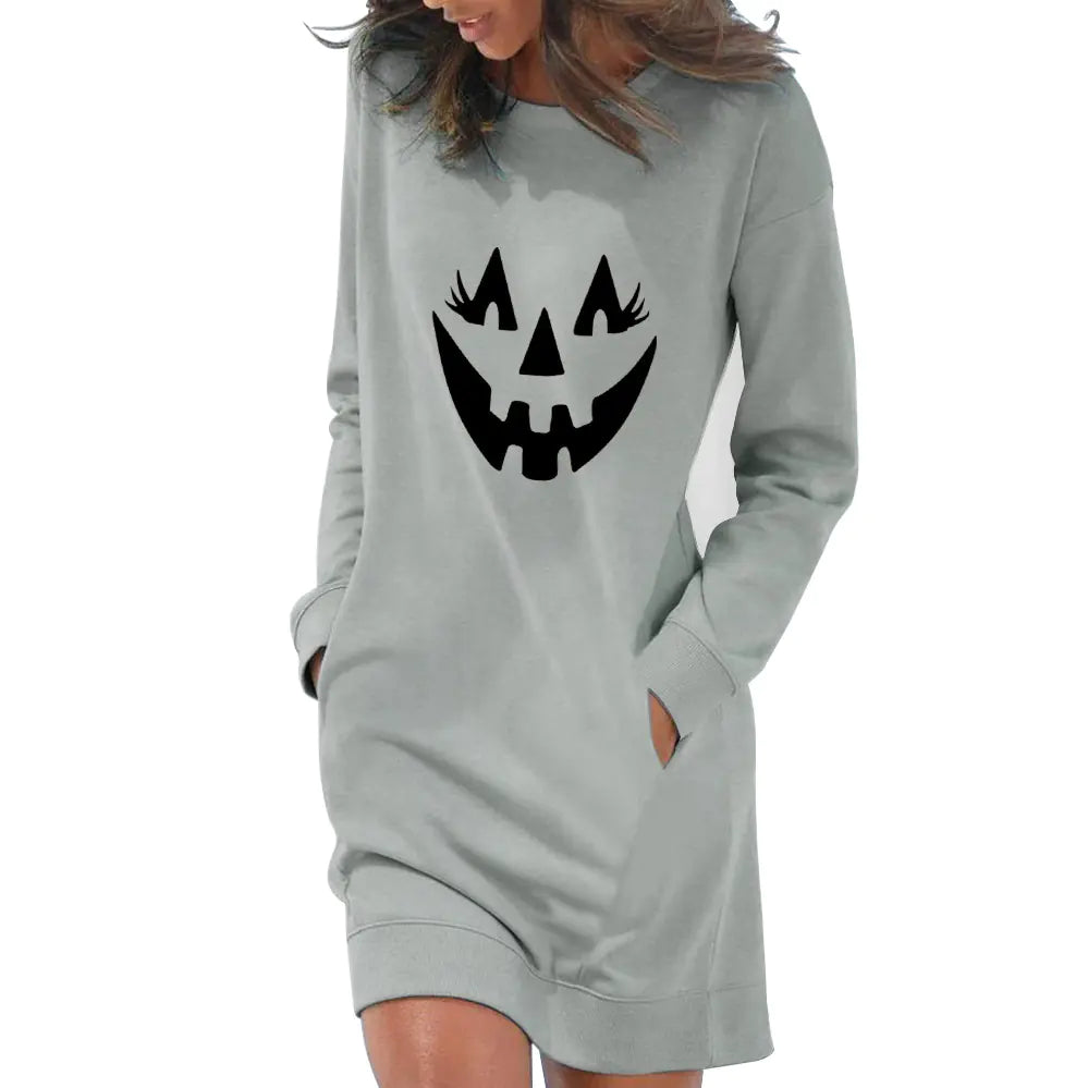 Gray sweatshirt dress with pumpkin face design on a white background