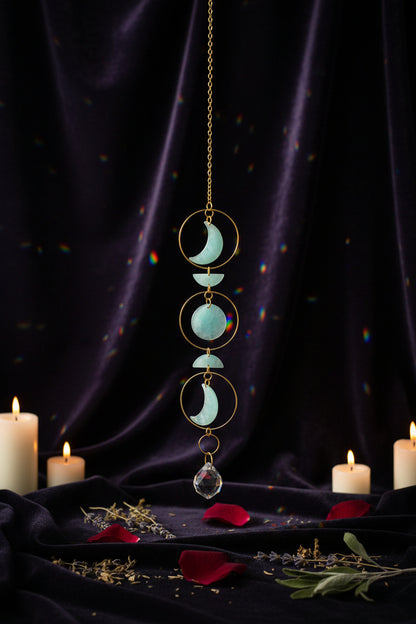 Decorative hanging chain with turquoise stones on a neutral background
