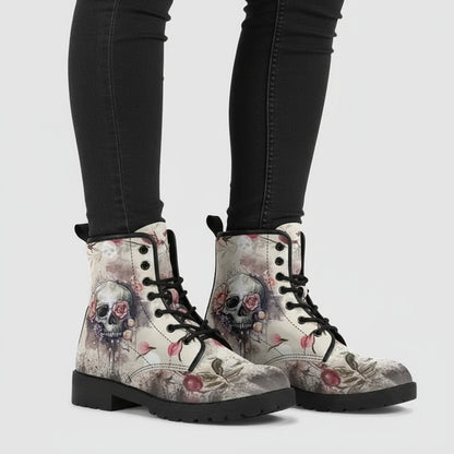 Boots with skull and floral design on a white background