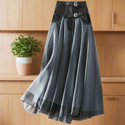 Long, dark gray skirt with a black belt on a white background