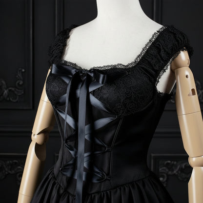 Black lace lingerie on a mannequin against a white background