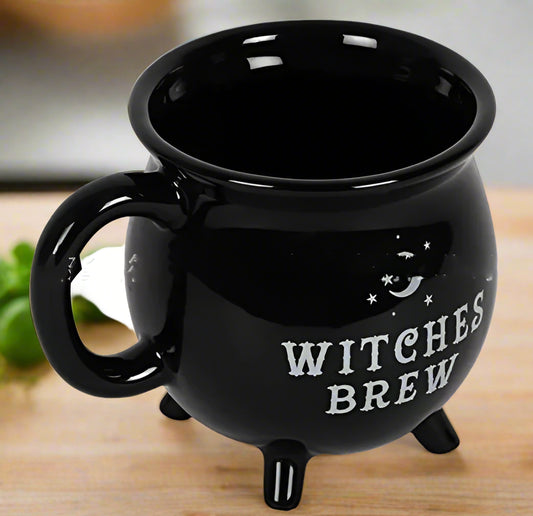 Black mug with 'Witches Brew' text on a white background