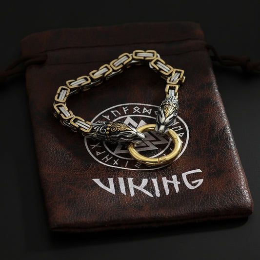 Bracelet with wolf design on a brown drawstring bag labeled 'Viking'.