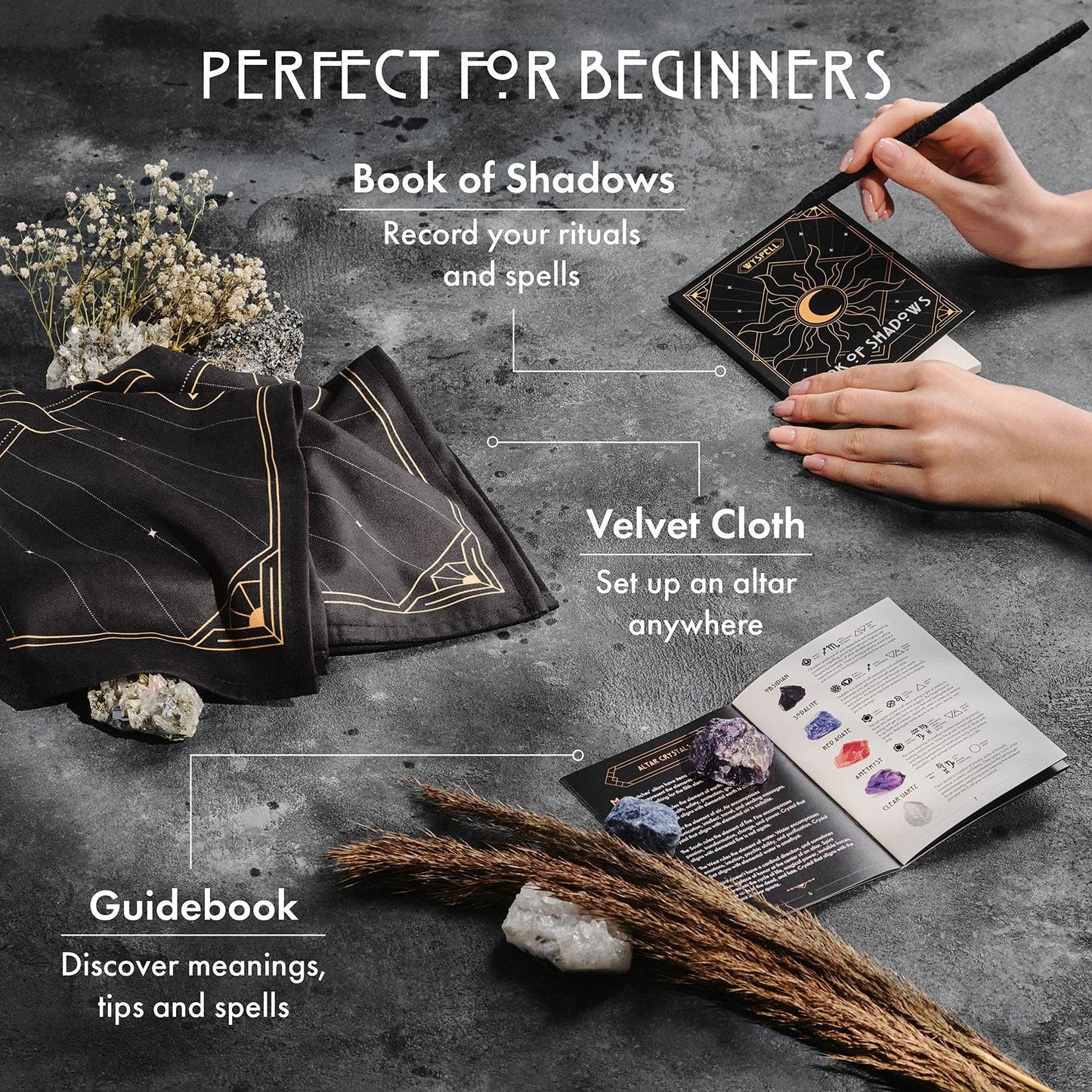 Witchcraft tools set with Book of Shadows, velvet cloth, and guidebook on a dark surface.