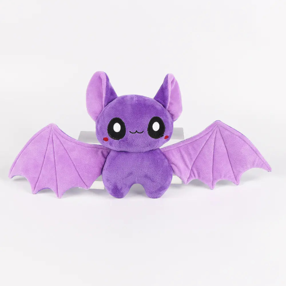 Purple plush bat toy on a white background