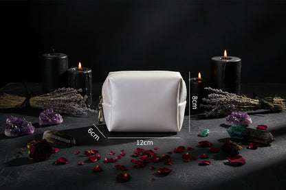 White cosmetic bag with dimensions on a light gray background