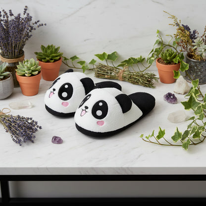 Pair of panda-shaped slippers on a white background