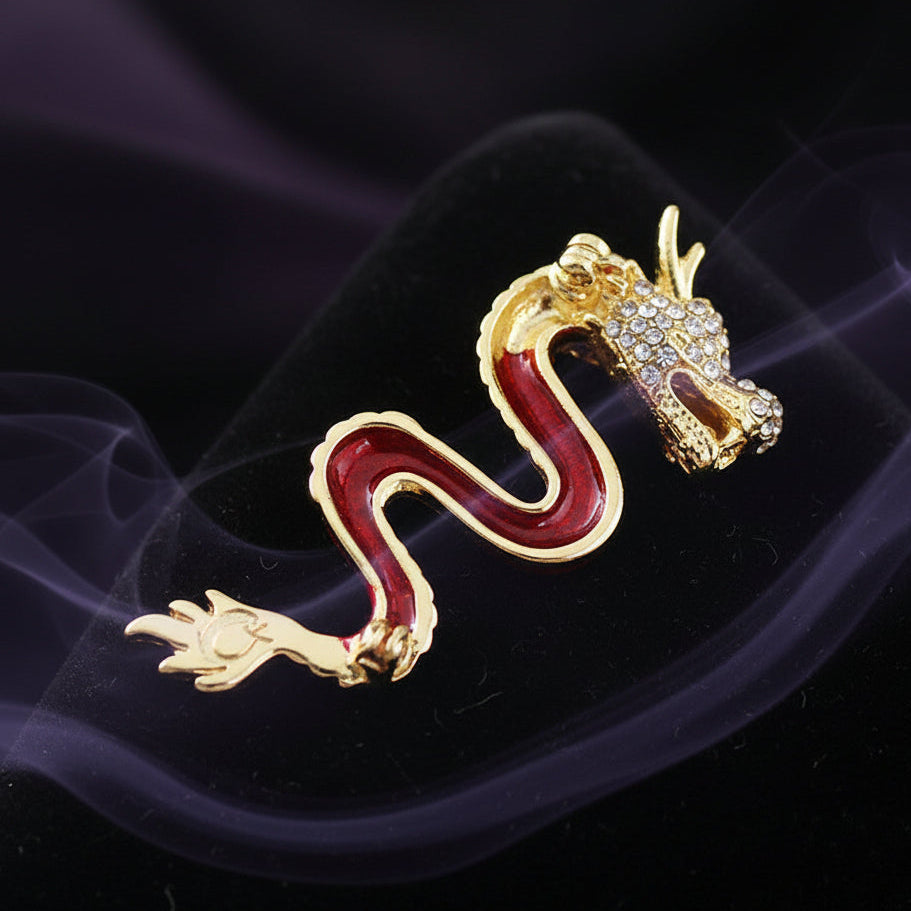 Gold dragon-shaped jewelry on a bamboo mat