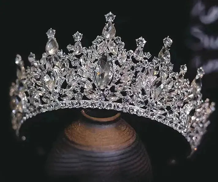 Silver tiara with clear stones on a dark background