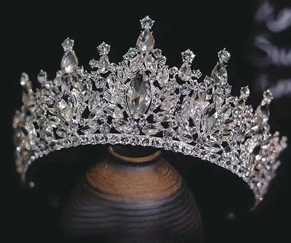 Silver tiara with clear stones on a dark background