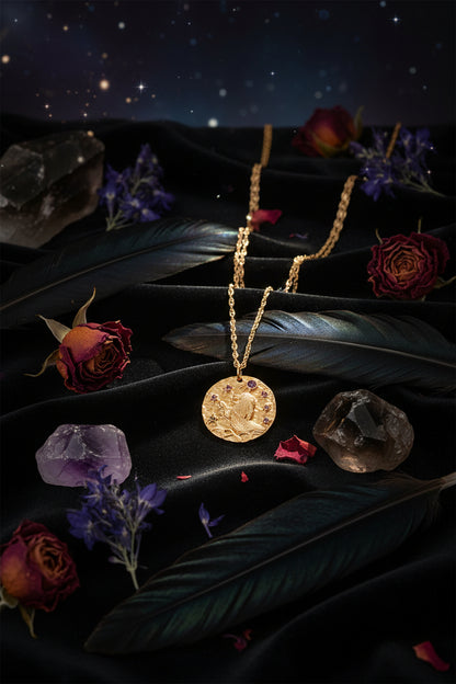 Gold necklace with a circular pendant on a white background