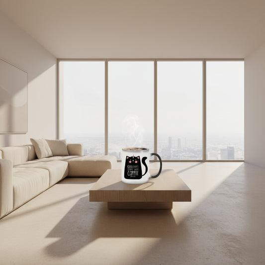 Black mug on the left and white mug with a cat design on the right, filled with coffee.