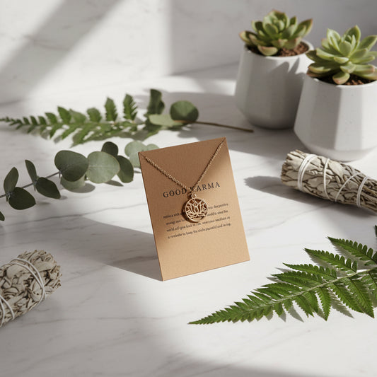 Gold necklace with 'Good Karma' card on a white background
