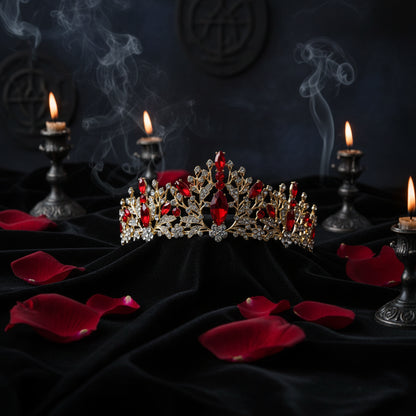 Ornate tiara with red stones on a pink background