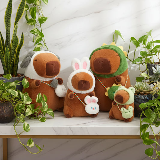 Set of brown plush toys with animal ears and tails on a beige surface.