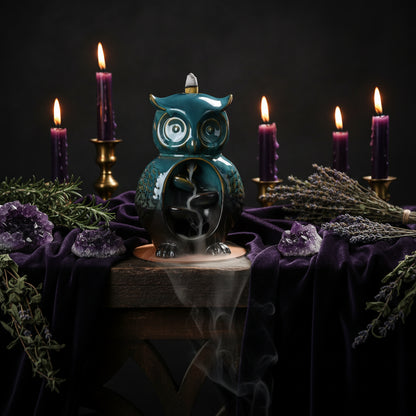 Blue owl-shaped incense burner on a wooden base with text about technology and style.