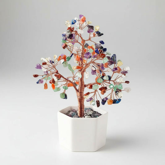 Decorative crystal tree in a white pot on a white background