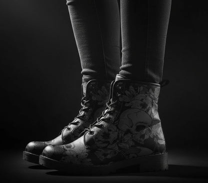 Black floral and skull patterned boots on a white background