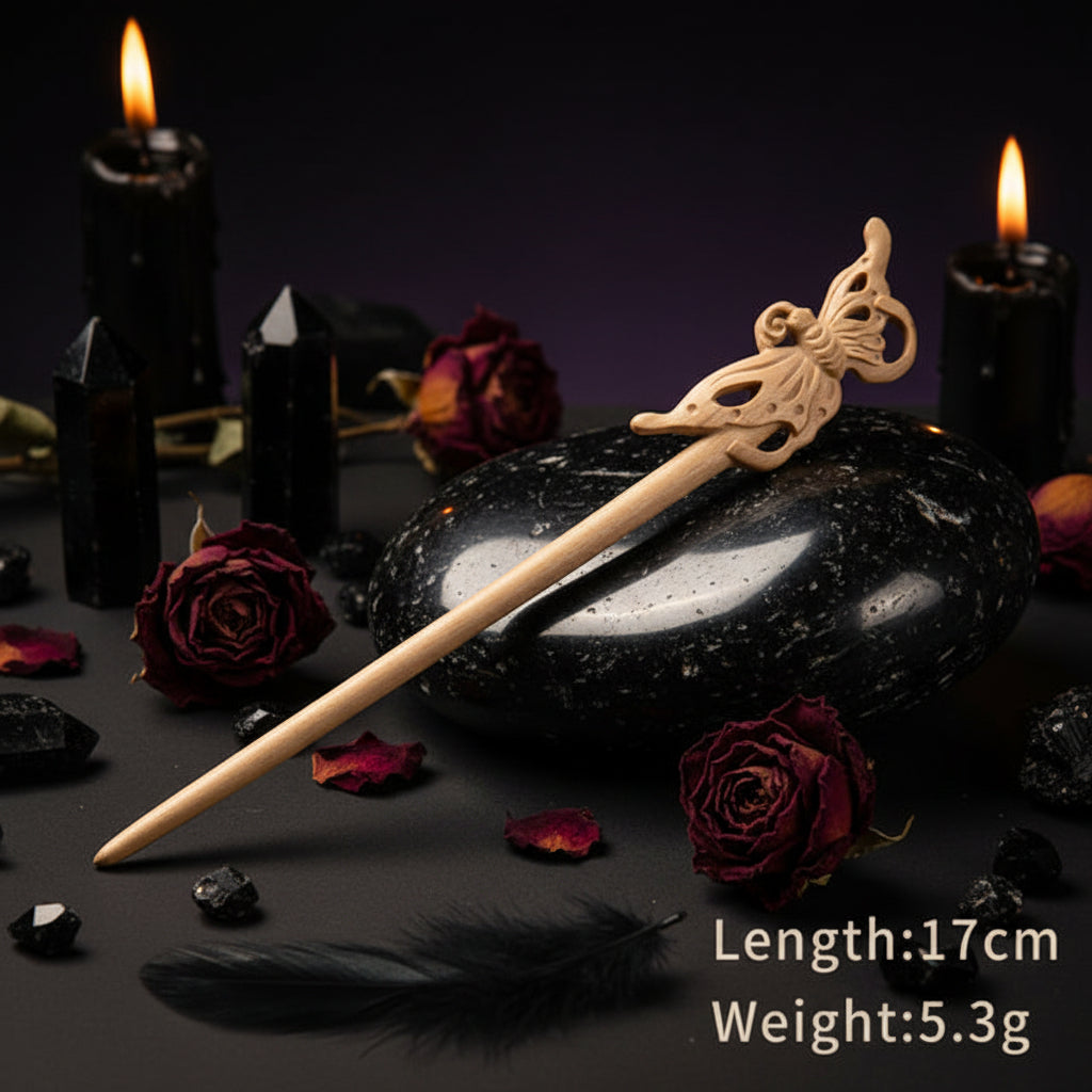 Wooden hair stick with decorative element on a white stand, against a light background.