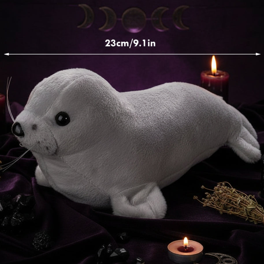 Plush toy seal with measurement label on a white background