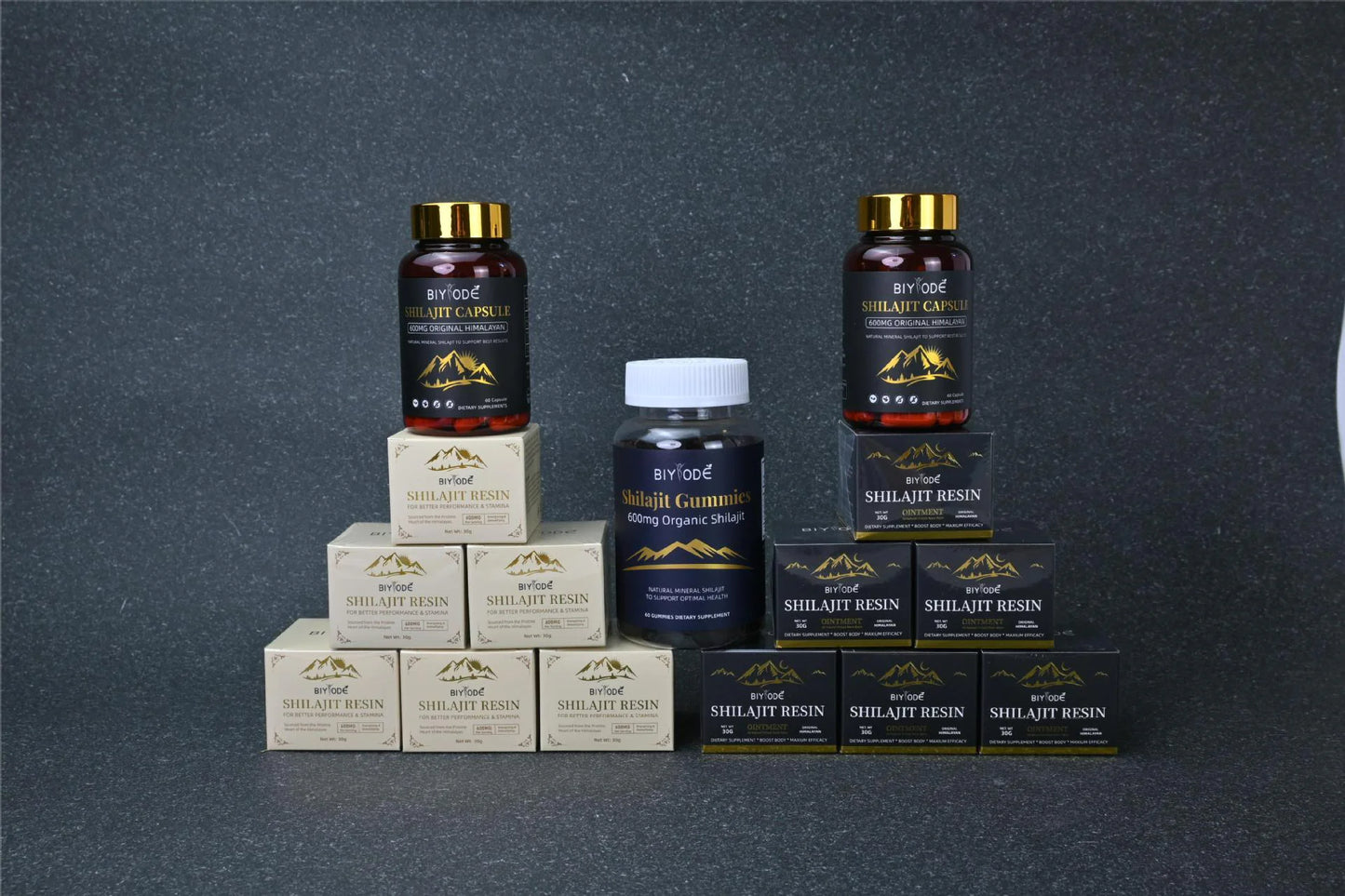Collection of Shilajit resin products on a dark background