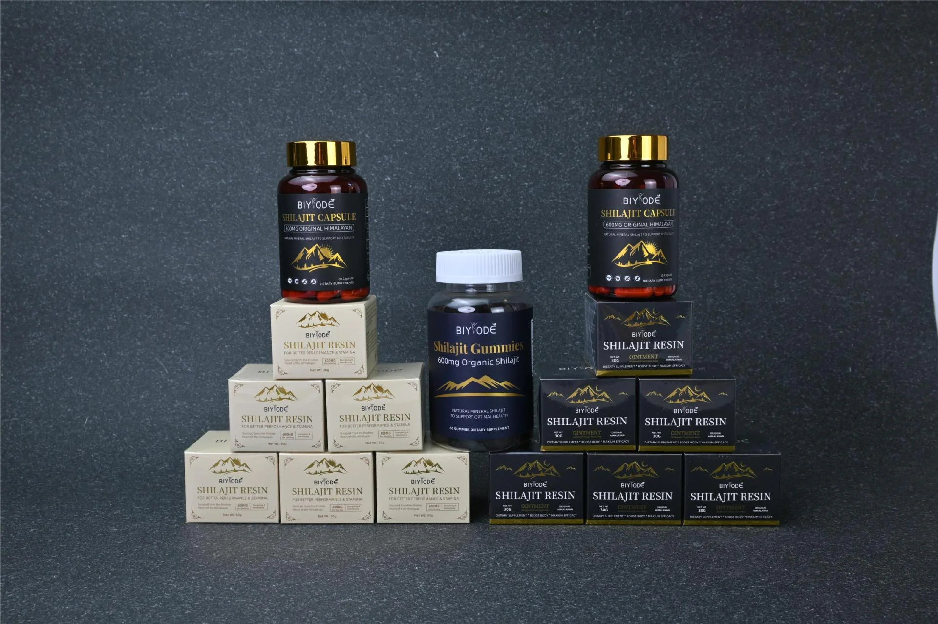 Collection of Shilajit resin products on a dark background