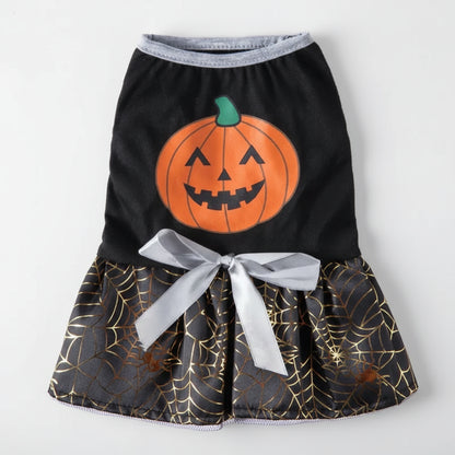 Halloween-themed pet dress with pumpkin design and spider web pattern on a white background