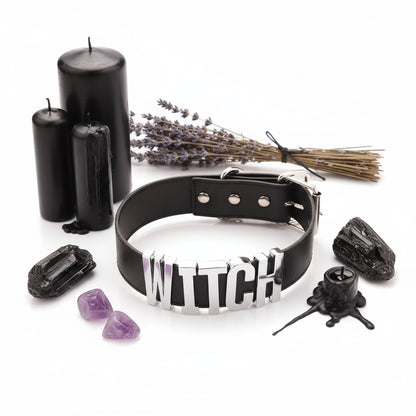 Black leather collar with metallic 'WITCH' letters on a white background