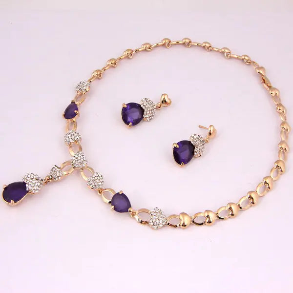 Jewelry set with necklace and earrings on a light purple background